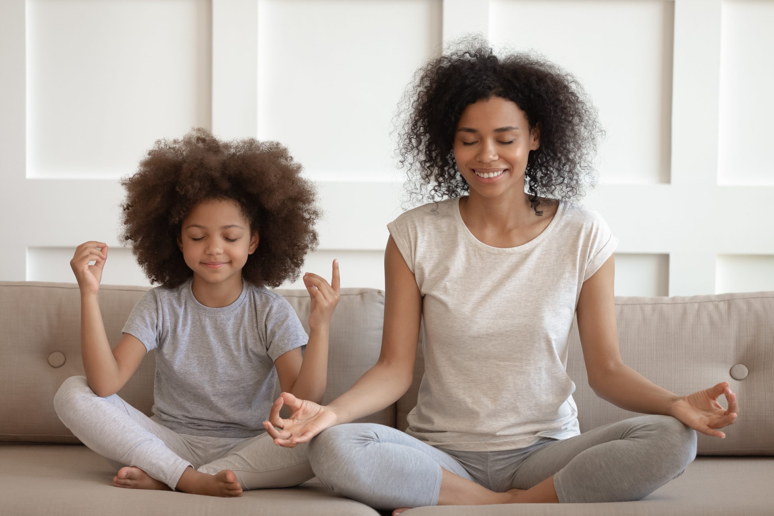 Mother and child practicing yoga together