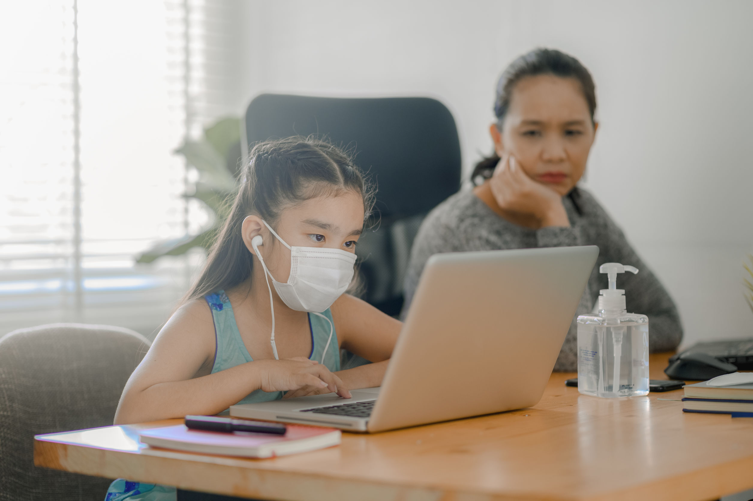 A girl using laptop for attending online class