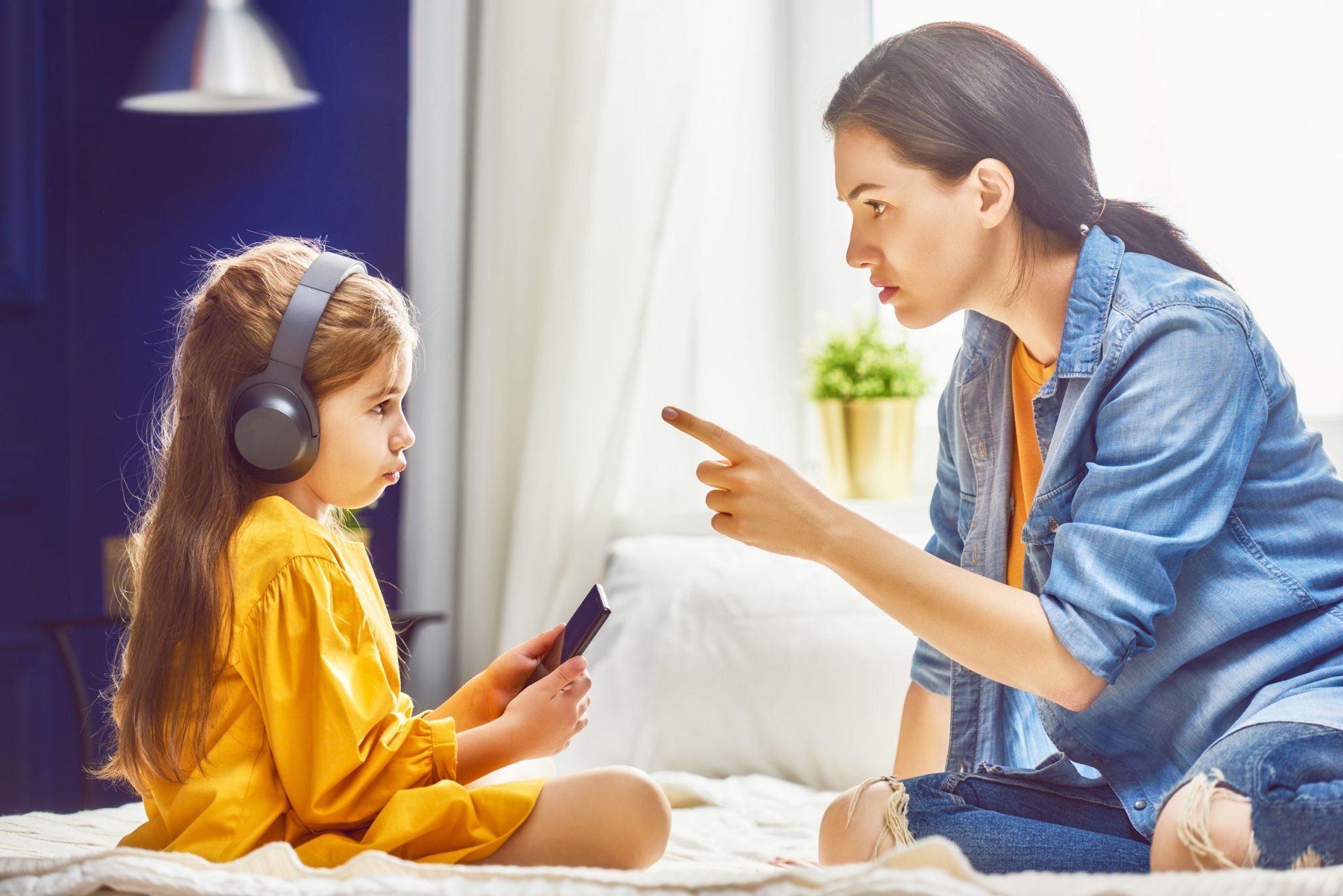 A mother is awaring her child about using internet on phone